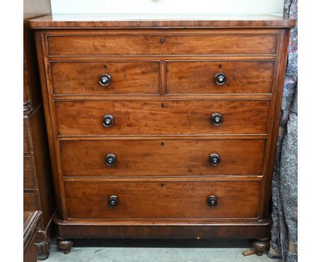 A large Victorian mahogany chest with shallow drawer over two short and two long standard drawers with turned mother-of-pearl
