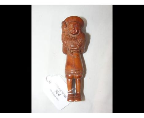 A Japanese wood carving/netsuke depicting a foreigner clutching a cockerel - 10cm tall 
