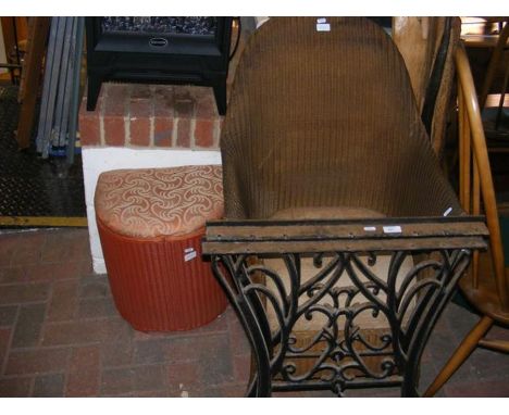A pair of wrought iron table ends, together with a cane garden chair and ottoman 