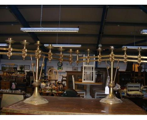 A pair of ecclesiastical brass adjustable candelabra - 40cms high