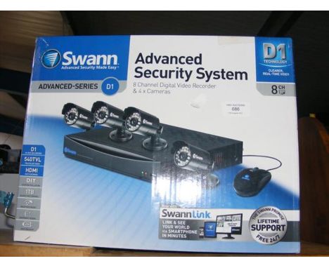 An Swann advanced security system in box including eight channel digital video recorder and four cameras