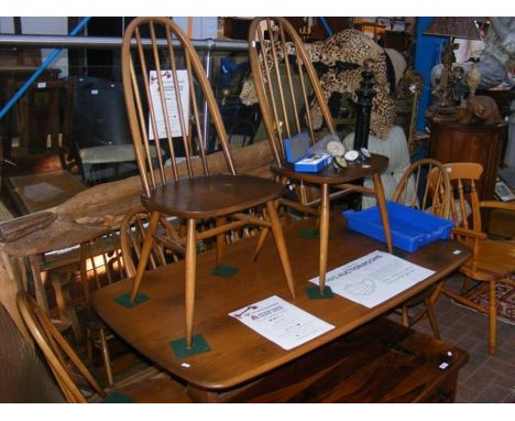 A rectangular Ercol dining table with six matching chairs - length of table - 150cm 