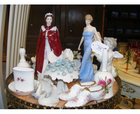 A Royal Doulton Diana Princess of Wales figure, Royal Worcester Queen Elizabeth figure, Chessell Pottery swans and Cognac Mar