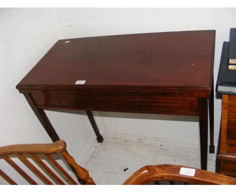 A mahogany card table on tapered legs - width 80cm 