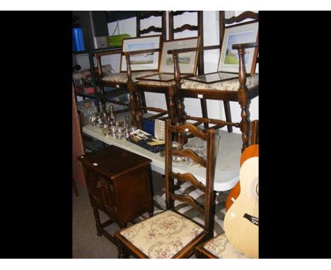 A small oak two door cupboard, together with a set of six ladder back dining chairs 