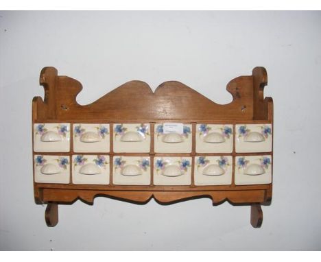 A reproduction continental hanging spice rack 
