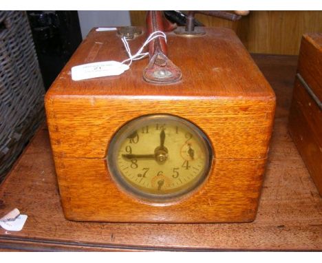 A pigeon racing clock in oak case 