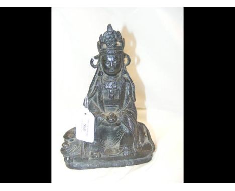 A Chinese Ming model of Guanjing - the bronze deity seated on mythical beast - 20cm tall - circa 15th/16th century CONDITION 