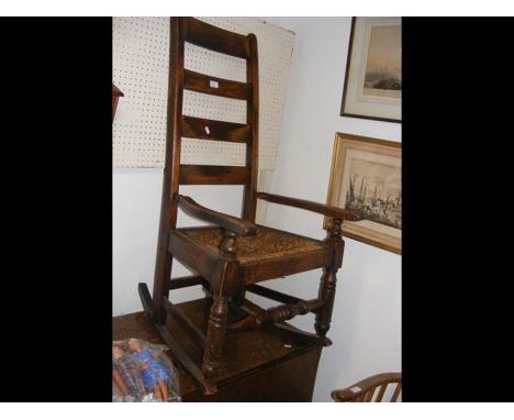 A ladder back rocking chair with rush seat 