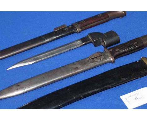 THREE WWII PERIOD BAYONETS
together with a short sword with hardwood handle and black leather scabbard (4)