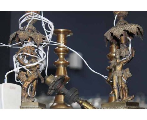 PAIR OF UNUSUAL BRASS CANDLESTICK LAMPS
modelled as two figures in armour holding a floral weath aloft, each 33cm 
