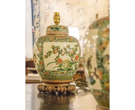 LAMPS, a pair, Chinese ceramic ginger jars, with famille rose panelled decoration, and pierced hardwood bases (58cm H with sh