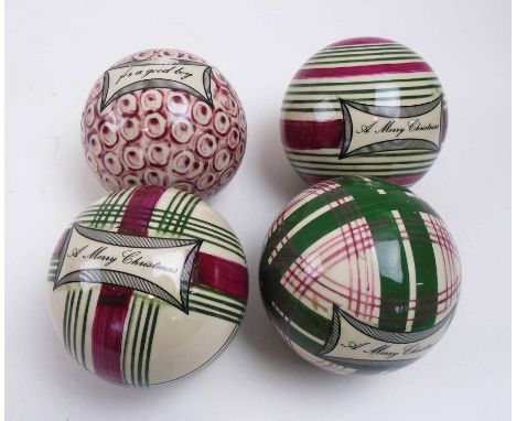 FESTIVE CERAMIC CARPET BOWLS, four various of which three bear the wording 'A Merry Christmas', all 8cm D. (4)