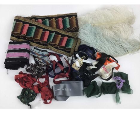 Tapestry edgings, ribbons, feathers, needlework book plus a small quantity of tassel trim. Plus Hermes, Gucci and ribbons