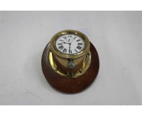 Early 20th century 8 Day car clock by Doxa in circular brass caseCondition report: Clock is actually a Goliath watch in a cas