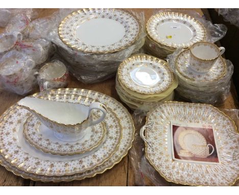 Spode Gold Fleur de Lys pattern dinner and tea service comprising, twelve dinner plates, twelve side plates, eleven tea plate