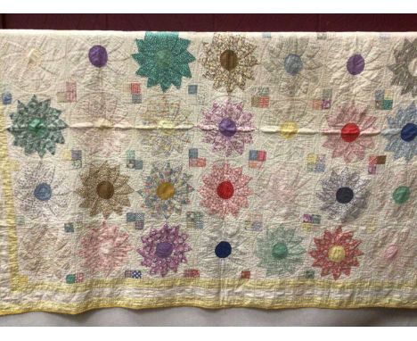 Three vintage hand and machine stitched patchwork quilts.Condition report: White quilt with blue stars has some staining all 
