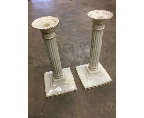 Pair of early 20th century Copeland candlesticks, classical form, cream glazed, marked to base and with retailers mark for Mo