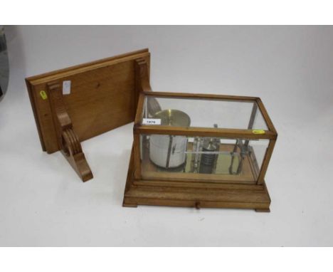 Oak cased barograph on wall bracket by Negretti and ZambraCondition report: The barograph appears to require work in order to