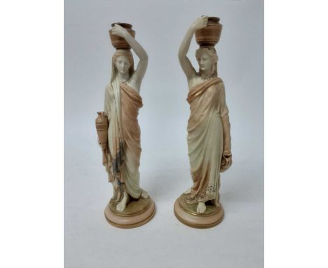 Pair of Royal Worcester Blush Ivory candlesticks In the form of female water carriersCondition report: Both candlesticks are 