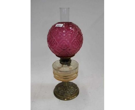 Edwardian oil lamp with cranberry glass shade, cut glass reservoir on embossed brass baseCondition report: Shade has minor ni