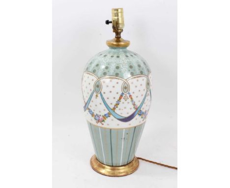 Continental porcelain table lamp, tall baluster form decorated with swags on peppermint green ground, with gilt metal mounts,