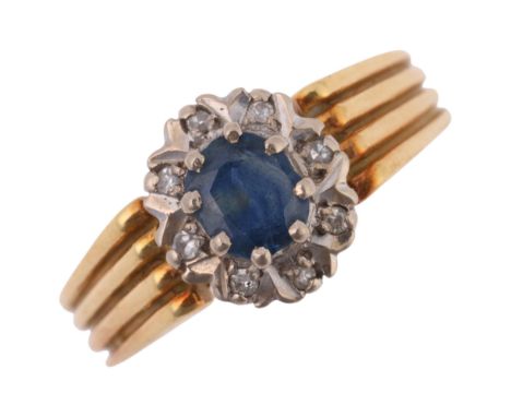 An 18ct gold sapphire and diamond flowerhead cluster ring, William Edward Ginder Ltd, possibly Birmingham 1972, set with oval