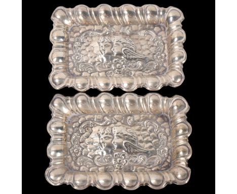 A pair of Edwardian silver pin dishes, Henry Hobson & Sons, Sheffield 1903, rectangular form, with relief embossed cherub and