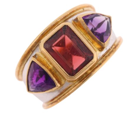 THEO FENNELL - an 18ct two-colour gold three stone garnet and amethyst bombe ring, London 1991, rub-over set with octagonal s