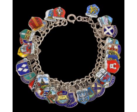 A Vintage sterling silver curb link charm bracelet, with various enamel shield travelling charms, including Battle Abbey, Mou