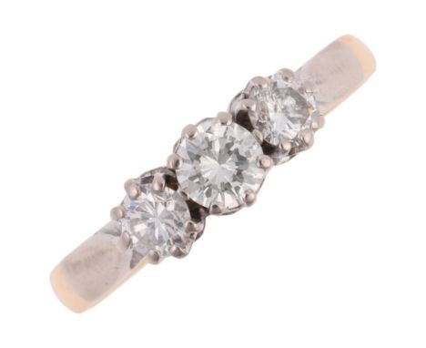 An 18ct gold three stone diamond ring, maker PB, London 1978, claw set with modern round brilliant-cut diamonds, total diamon