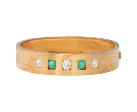 An Antique Victorian 18ct gold five stone emerald and diamond hinged bangle, circa 1860, square set with oval and round old-c