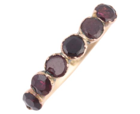 An Antique Georgian 9ct gold flat-top garnet half hoop ring, cut-down collet set with foil-back round flat-top garnets, with 