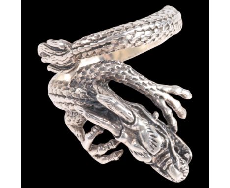 A sterling silver 'Chinese Dragon' ring, setting height 30mm, size V, 11g . Condition Report:No damage or repair, marked 925