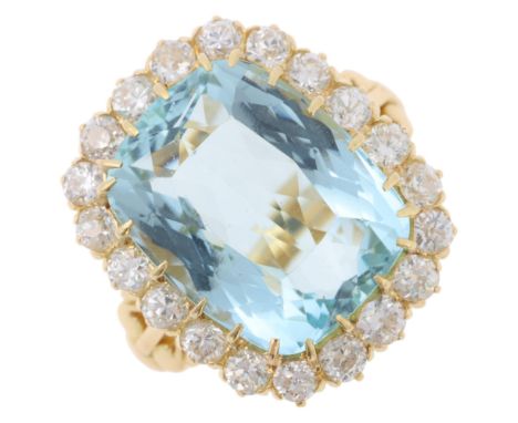 An 18ct gold aquamarine and diamond cluster ring, set with 10ct cushion-cut aquamarine surrounded by round transitional-cut d