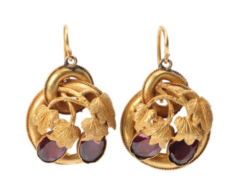A pair of Antique Victorian garnet drop earrings, circa 1860, the chased floral motif set with oval flat-top garnets, with sh