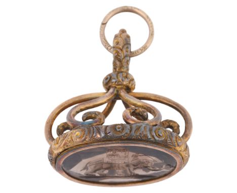 A large Antique Victorian smoky quartz 'Royal Indian Elephant Caravan' seal fob, intaglio carved depicting caparisoned elepha