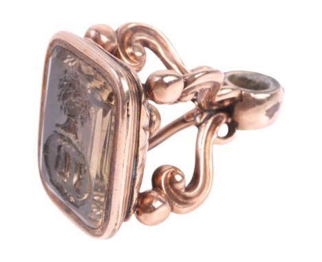 An Antique Victorian smoky quartz seal fob, the foil-back smoky quartz intaglio carved with cartouche bearing initials JB, be