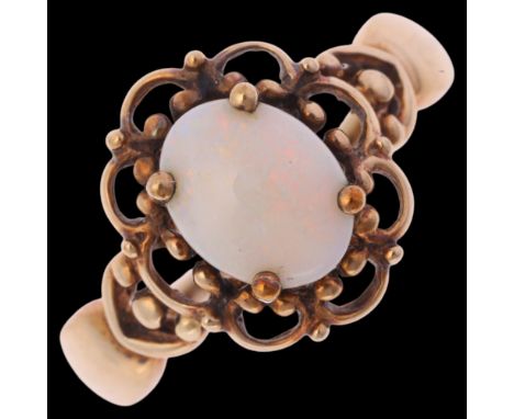 A 9ct gold single stone opal dress ring, by QVC, import Birmingham 1998, claw set with oval cabochon opal with an openwork su