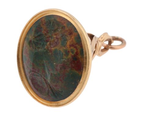 An Antique Georgian 9ct gold jasper hardstone seal fob, intaglio carved depicting Classical Green profile, in foliate openwor