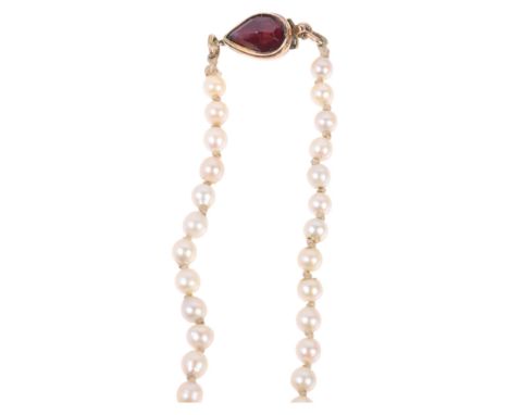 A Vintage single-strand graduated pearl bead necklace, unmarked gold garnet clasp, pearls measure 3.6 - 7.1mm, necklace 46cm,