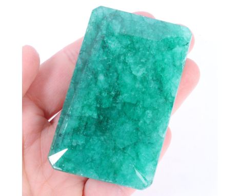 A 468ct unmounted rectangular step-cut emerald, 69.00 x 41.00 x 20.00mm, evidence of colour enhancement, with GLI report card
