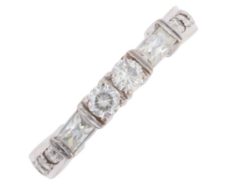 An 18ct white gold diamond half eternity ring, set with modern round brilliant and elongated Princess-cut diamonds, total dia