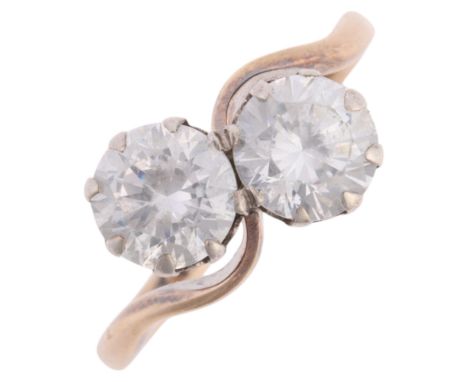 A Vintage 9ct gold and silver two stone cubic zirconia crossover ring, setting height 10.1mm, size K, 2.4g . Condition Report