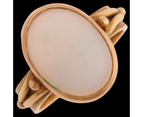 An 18ct gold single stone opal ring, rub-over set with 1.6ct oval cabochon opal, unmarked mount tests as 18ct, setting height