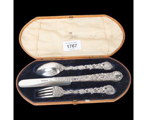A Victorian silver Vine pattern christening eating set, George Adams, London 1863, comprising knife, fork and spoon, knife 20