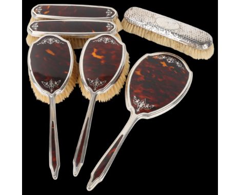 An Art Deco George V silver tortoiseshell pique inlaid 5-piece dressing table set, Mappin & Webb, London 1931, comprising han