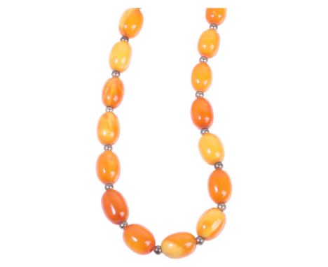 A Vintage single-strand butterscotch amber bead necklace, beads measure: 12.6mm - 10.6mm, 40cm, 19g . Condition Report:A few 