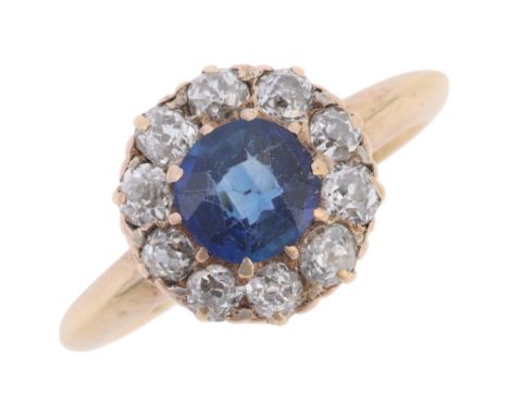 An Antique 18ct gold sapphire and diamond cluster ring, claw set with round-cut sapphire and surrounded by old-cut diamonds, 