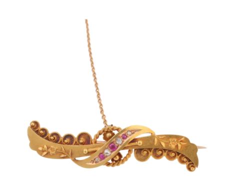 A late Victorian Etruscan Revival 15ct gold ruby and diamond brooch, maker FB, Chester 1897, 41.5mm, 3.3g . Condition Report: